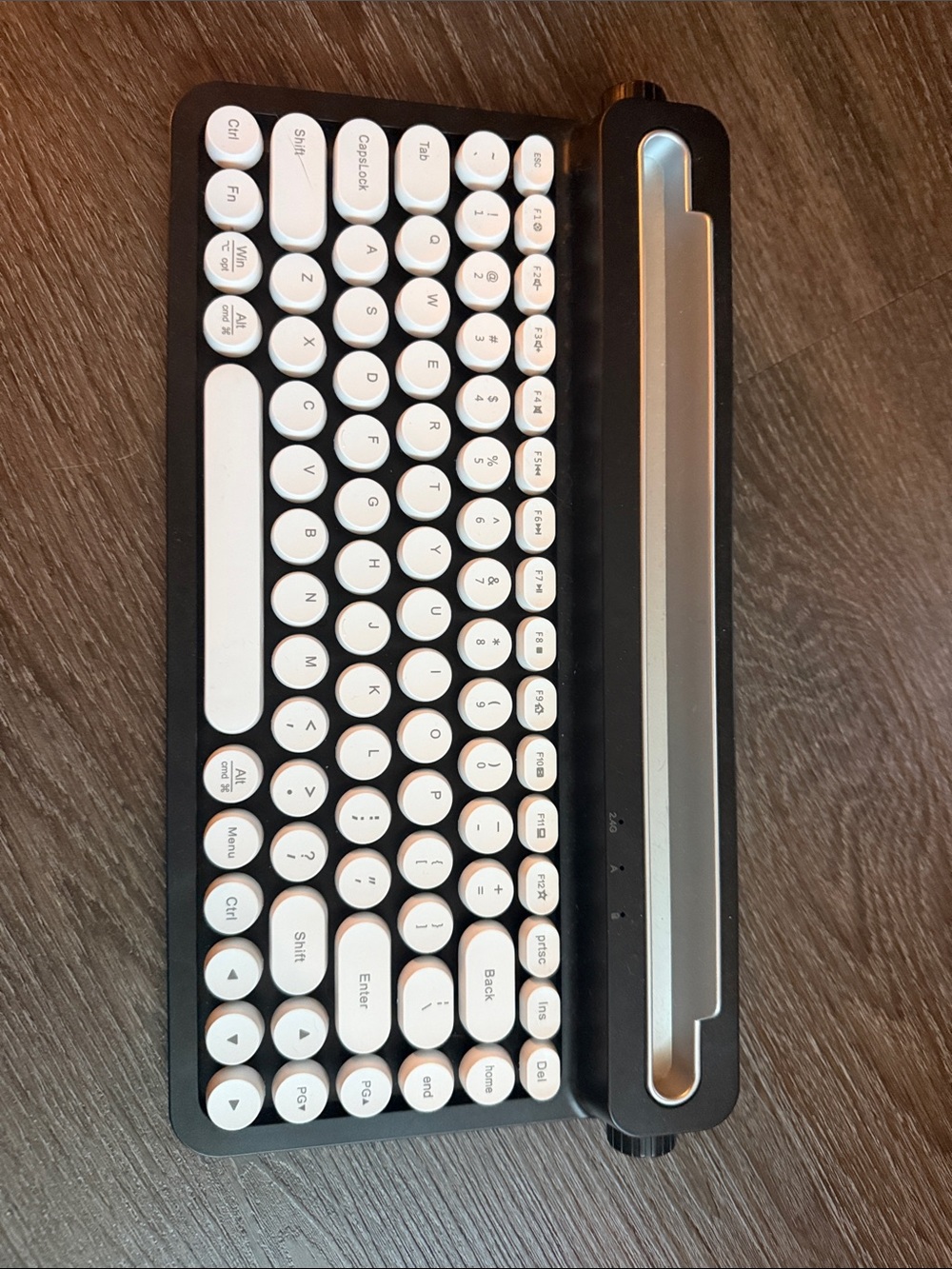 Compact Black and White Retro Wireless Keyboard with Device Stand